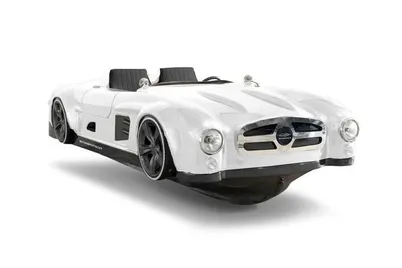 White retro-futuristic flying roadster with black seats hovering against a clean white background.